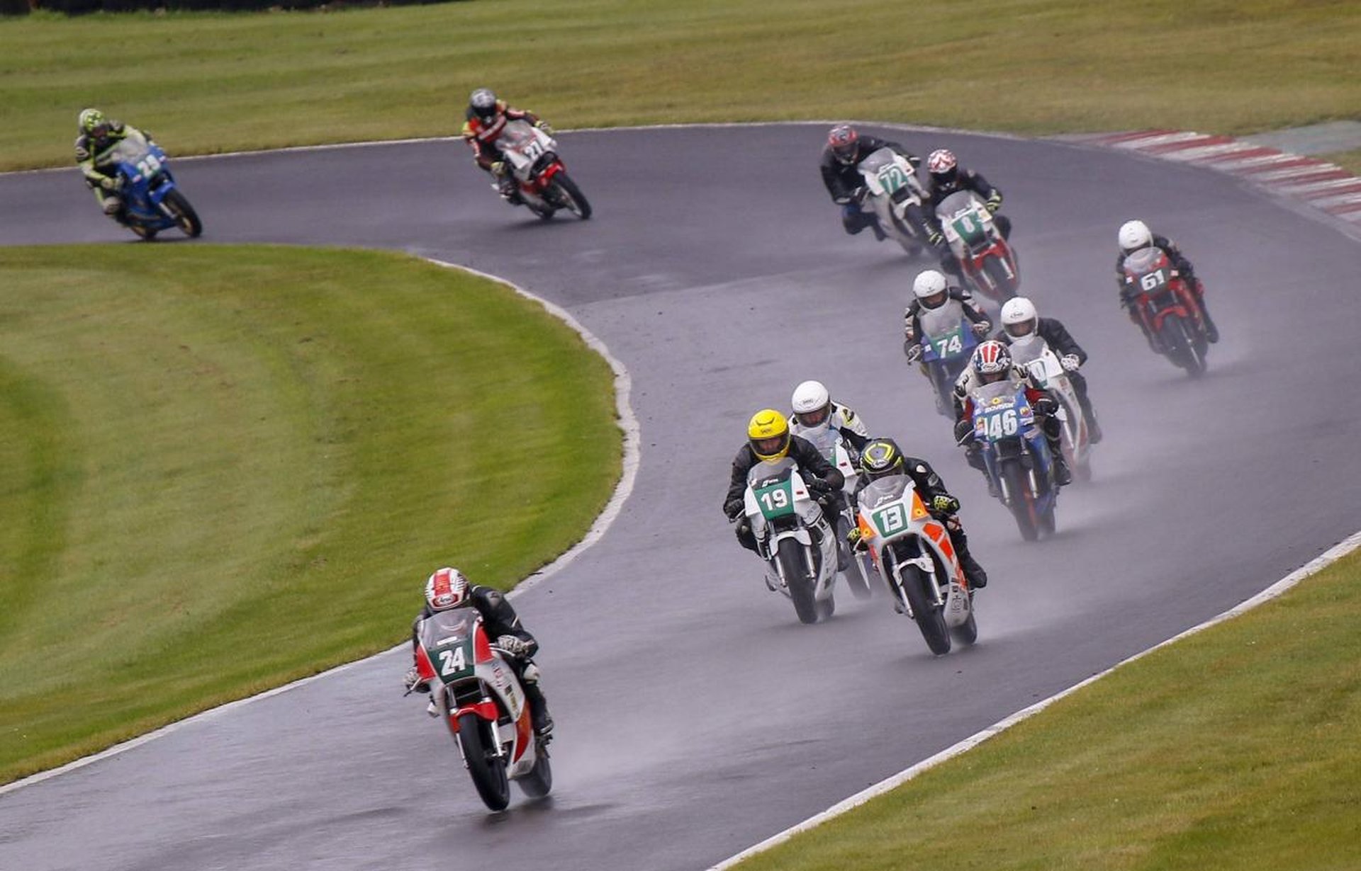 Image of The pack round a bend at rainy Cadwell Park